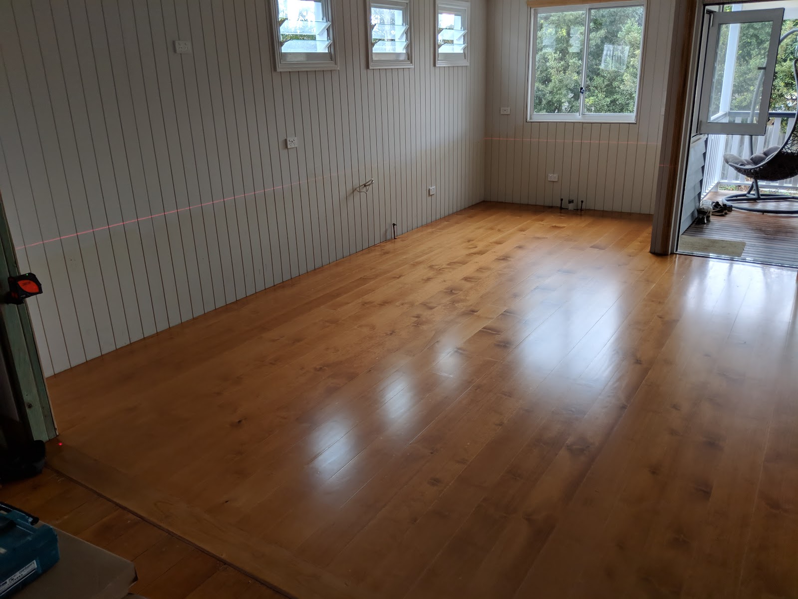 Kitchen before renovation with bare timber floors